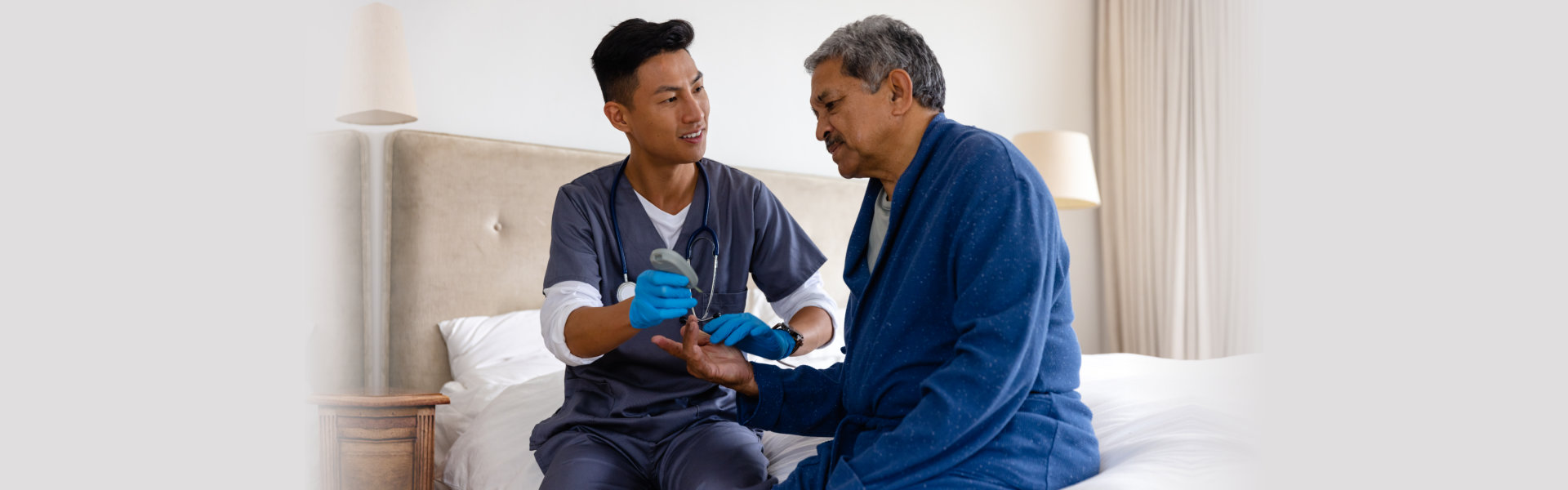 doctor testing blood of senior male patient